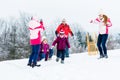 Family with kids having snowball fight in winter Royalty Free Stock Photo