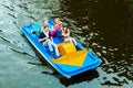 Family with kids on pedal boat