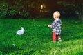 Family with kids in the petting zoo. Royalty Free Stock Photo