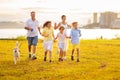 Family with kids running outdoor at sunset Royalty Free Stock Photo