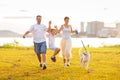 Family with kids running outdoor at sunset Royalty Free Stock Photo