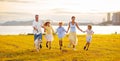 Family with kids running outdoor at sunset Royalty Free Stock Photo