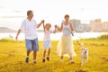 Family with kids running outdoor at sunset Royalty Free Stock Photo