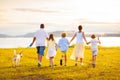 Family with kids running outdoor at sunset Royalty Free Stock Photo