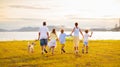 Family with kids running outdoor at sunset Royalty Free Stock Photo