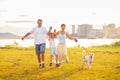 Family with kids running outdoor at sunset Royalty Free Stock Photo