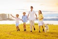 Family with kids running outdoor at sunset Royalty Free Stock Photo