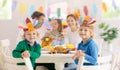 Family with kids at Thanksgiving dinner. Turkey Royalty Free Stock Photo