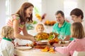 Family with kids at Thanksgiving dinner. Turkey Royalty Free Stock Photo