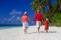 Family with kids walking on tropical beach Royalty Free Stock Photo