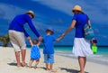 Family with kids walking on tropical beach Royalty Free Stock Photo