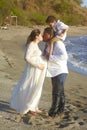 Family kiss on beach Royalty Free Stock Photo