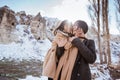 family kissing each other during travelling in cappadocia enjoying the view