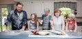 Family in kitchen after food fight