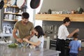 Family In Kitchen Making Morning Breakfast Together Royalty Free Stock Photo