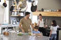 Family In Kitchen Making Morning Breakfast Together Royalty Free Stock Photo