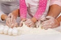 Family kneading dough Royalty Free Stock Photo