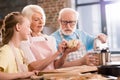 Family kneading dough Royalty Free Stock Photo