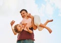 This family knows how to have fun. Portrait of a happy little girl and her father playing together in their backyard at Royalty Free Stock Photo