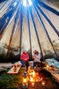 Family in Lappish hut Royalty Free Stock Photo