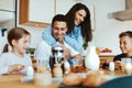 Family laughing over breakfast Royalty Free Stock Photo