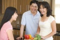 Family Laughing While Preparing Meal Royalty Free Stock Photo