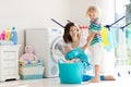 Family in laundry room with washing machine Royalty Free Stock Photo