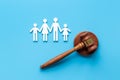 Family law or divorce concept. Family figure with judge gavel, top view