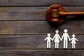 Family law or divorce concept. Family figure with judge gavel, top view