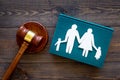 Family law, family right concept. Child-custody concept. Family with children cutout near court gavel on dark wooden Royalty Free Stock Photo