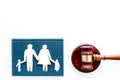 Family law, family right concept. Child-custody concept. Family with children cutout near court gavel on white