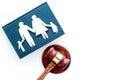 Family law, family right concept. Child-custody concept. Family with children cutout near court gavel on white