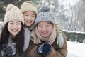 Family laying in snow for portrait