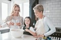 .Family, learning and cooking with grandmother in kitchen together for bond, cookies and wellness. Food, baking and Royalty Free Stock Photo