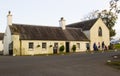 A family leaving the small tea shop in Castlewellan Country Park during a mid term school break. Royalty Free Stock Photo