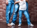 Family legs wearing blue jeans Royalty Free Stock Photo