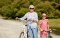 Grandmother and granddaughter with bicycles Royalty Free Stock Photo