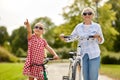 Grandmother and granddaughter with bicycles Royalty Free Stock Photo