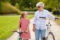 Grandmother and granddaughter with bicycles Royalty Free Stock Photo