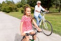 Grandmother and granddaughter cycling at park Royalty Free Stock Photo