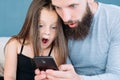 Family leisure shock amazed dad kid reaction phone