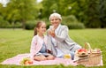 Grandmother and granddaughter take selfie at park Royalty Free Stock Photo