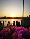 family lelax on dock in evening time Royalty Free Stock Photo