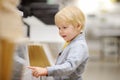 Family with little boy choosing the right furniture for their apartment in a modern home furniture store Royalty Free Stock Photo