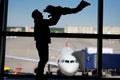 Family with little boy at the international airport. Father with his cute little son waiting boarding Royalty Free Stock Photo