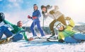 A family with little son dressed ski clothes sincerely smiling and laughing posing for photo on the snow ski hill at the Slovakian Royalty Free Stock Photo