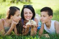 Family with little yellow duckling in summer Park Royalty Free Stock Photo