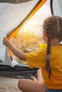 Family local getaway. Kid having rest in the camping tent at campsite, active lifestyle