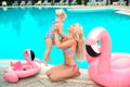 Family look. Beautiful mother having fun with daughter. Happy summer vacations.  Blonde pretty woman with her little girl wear in Royalty Free Stock Photo