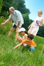 Family looking for insects Royalty Free Stock Photo